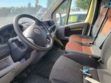 the interior of a small van with a steering wheel and dashboard