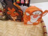 winnie the pooh and tigger the tiger coin purses on a table