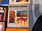 several books are stacked on top of each other on a table