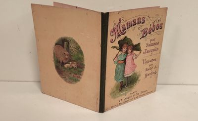 an old book with a picture of a girl and a pig