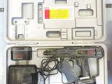 a tool in the case that is sitting on the floor