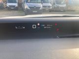 the dashboard of a car with a lot of cars in the background