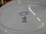 a close up of a white plate with a blue design on it