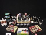 many different types of paint and supplies on the table