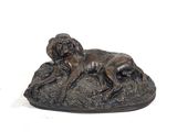 statue of a dog and a cat on a rock on a white background