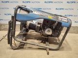 a blue and black generator sitting on a metal stand