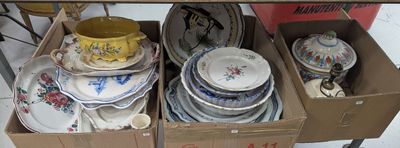 many plates and bowls in a box on the table