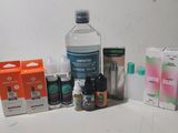 a bottle of water, a bottle of liquid, a box of medicine, and a box of pills