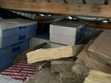 a pile of boxes and boxes on the floor of a room