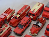 a lot of toy fire trucks that are on the table