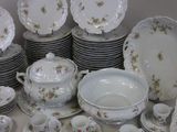 many plates and cups and saucers sitting on a table