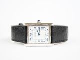 a close up of a wrist watch with roman numerals on it