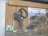 a wall with many different tools hanging on it