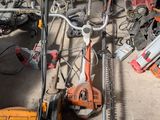 a lot of tools on the floor of a garage
