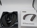 a box with a pair of headphones and a remote control