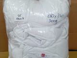 a bag of white yarn sitting on top of a cardboard box