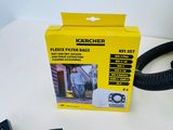 a black hose and a yellow box on a white table