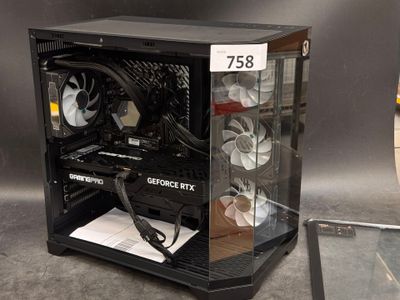 a computer case with a fan and a tablet on the table
