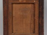 an old wooden easel with a painting on top of it