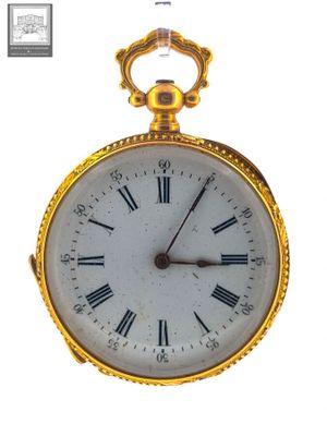 a gold pocket watch with roman numerals on the face