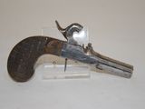 an old gun that is on display on a table