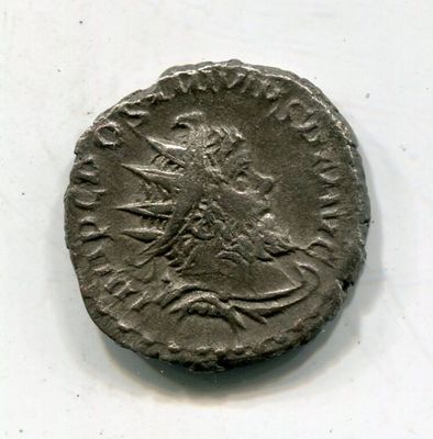 a close up of a coin on a table with a white background