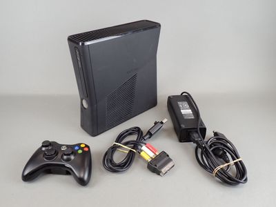 a video game system and a game controller on a table