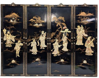 une image représentant un écran noir et doré orné de motifs asiatiques