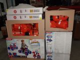 two boxes that have toys in them on top of each other