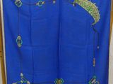 a blue cloth with green and gold designs on it