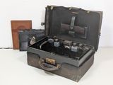 an old suitcase with a bunch of items inside of it