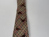 a neck tie with birds on it on a white background
