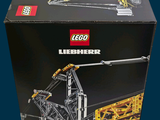 a box that has a lego crane inside of it