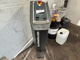 a machine that is sitting in the corner of a room