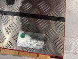 a close up of a piece of metal with a label on it
