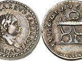 a silver coin with an image of a woman on it
