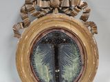 un cadre doré contenant la photo d'un palmier