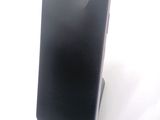 a cell phone that is sitting on top of a stand