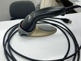 a cord connected to a computer mouse on a desk