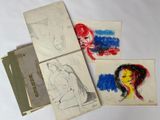 three drawings of a woman and a man are shown on a table