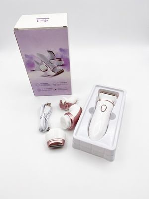 une boîte blanche contenant un appareil rose et blanc
