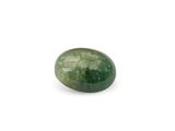 a close up of a green stone on a white surface