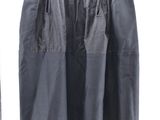 grey skirt hanging on a clothes line with a white background