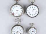 three silver pocket watches with roman numerals and roman numerals