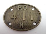 an old brass plate with the number 4 on it