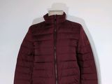 the jacket is maroon and has a hood on it