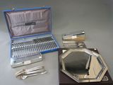 silverware and silverware in a case on a table