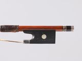 a close up of a violin bow on a white background