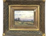 an oil painting of a landscape with trees and clouds in a gold frame