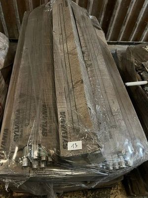 several pieces of wood are wrapped in plastic and stacked on top of each other